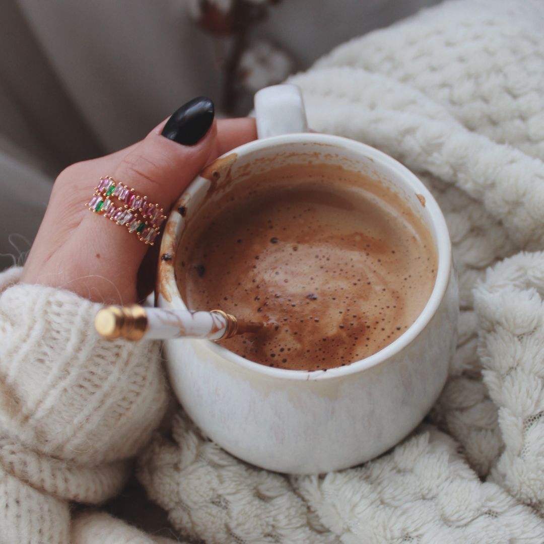 woman holding a cup of gratitude ritual superfood blend